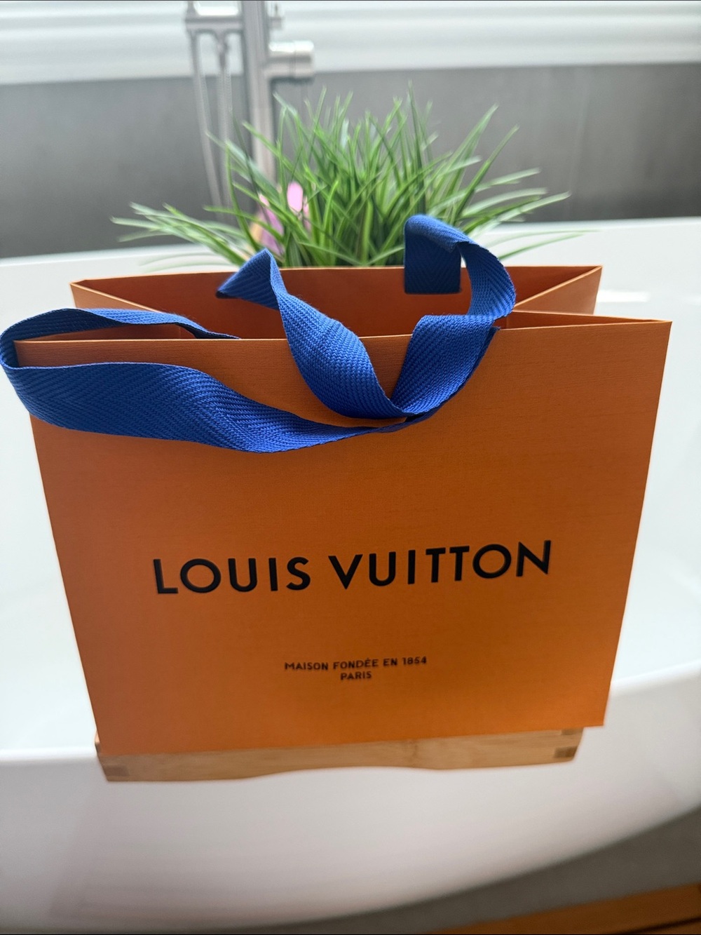 Small Louis Vuitton Orange Shopping Bag with Blue Ribbon Handles. 9X7 inches.